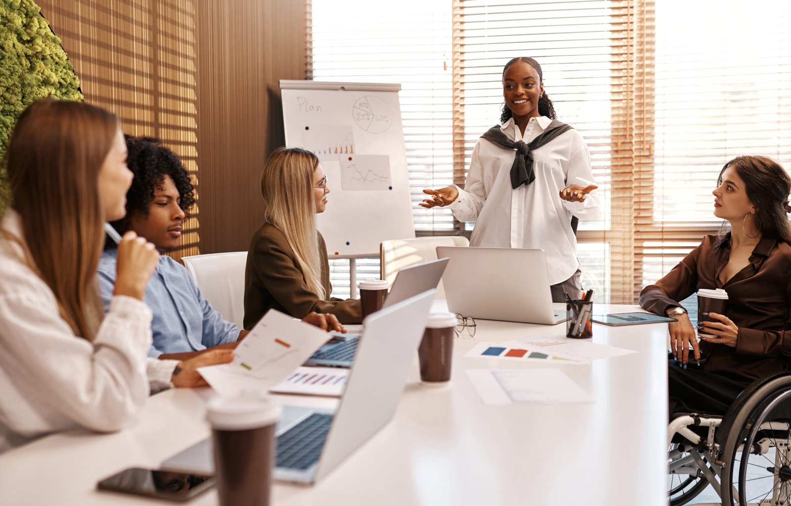Smiling presenter leading a team meeting